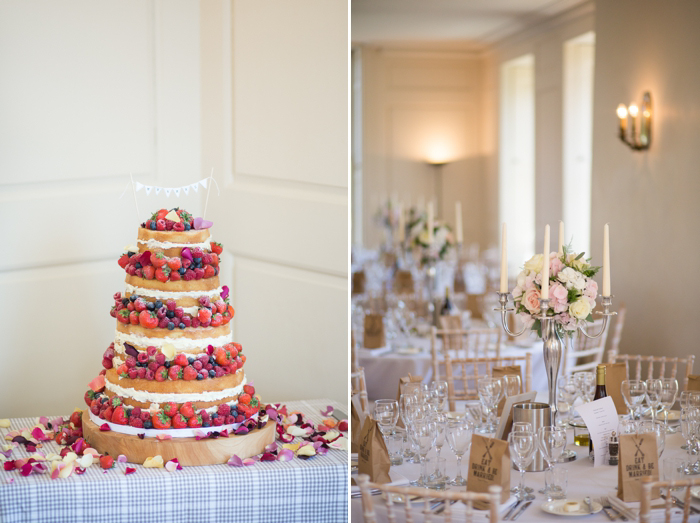 Delicious wedding cake with berries and cream and classic table settings with roses