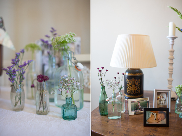wedding details with flowers and glass bottles