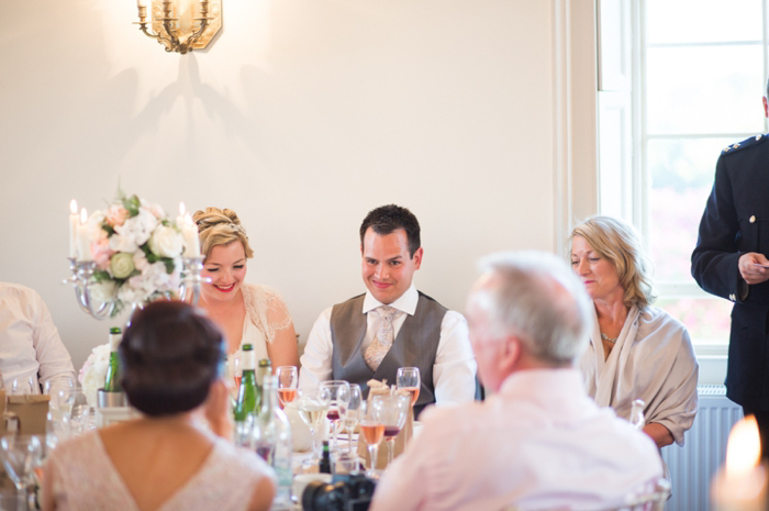 groom getting stitched up at Boconnoc wedding 