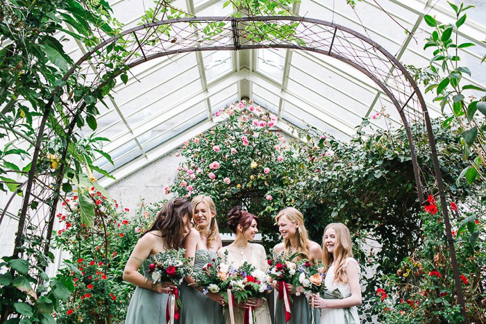 bride and bridesmaids photos in conservatory at Scorrier House